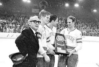 Craig Patrick, Tom Miller, Keith Magnuson and Murray Armstrong with the 1969 national championship trophy.