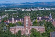 aerial shot over du campus with mountains in the background 