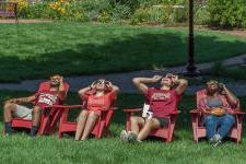 Members of the DU community look up at the solar eclipse