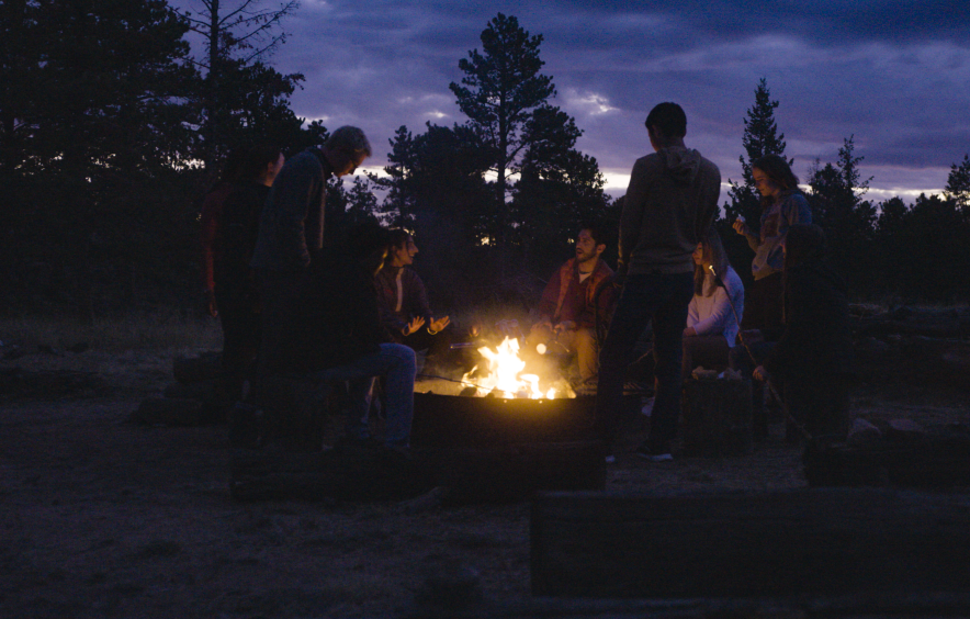 students around campfire