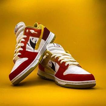 nike shoes with red and yellow paint 